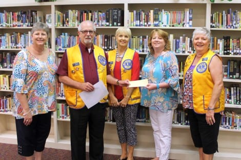 Lions Club Vice-President Franks Chambers presenting a check to D Ann Vonderau, Superintendant of High Island School District. Also pictured are Kathy Smith, Principal of High Island School and Lions Club members Brenda Flanagan and Charlotte Byus.