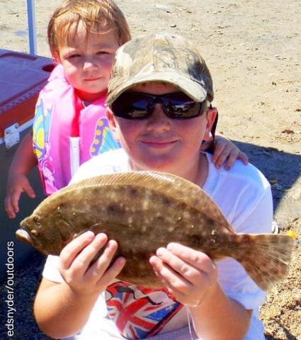 Brother Partner Currie of Crosby TX shows how its done for sister Braelan with this flounder he caught on a Miss Nancy shrimp