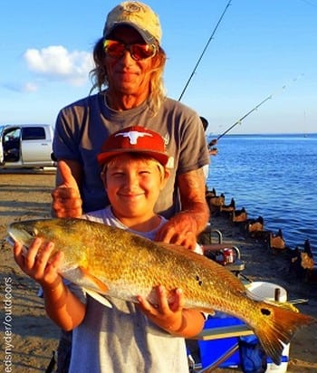 Father and son anglers Scott and Jaden Harper of Pittsburgh TX loaded up with this HUGE 44inch tagger bull red Jaden caught on a Miss Nancy shrimp