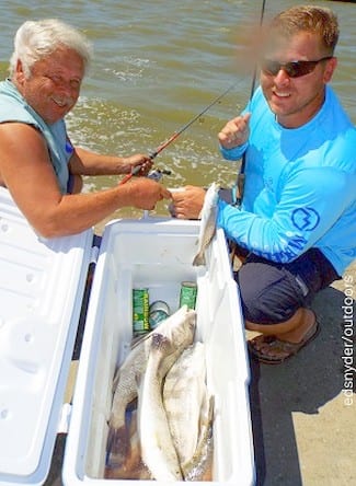 Father and son fishing team Don and J.R. Putz of Murfreesborough TN boxed up trout and drum on live shrimp