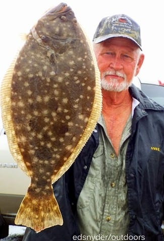 I AM SMILING growled Frank Bunyard as he hefted this 20inch flounder up for the camera- the Tarkington Prairie native caught it on a berkely gulp