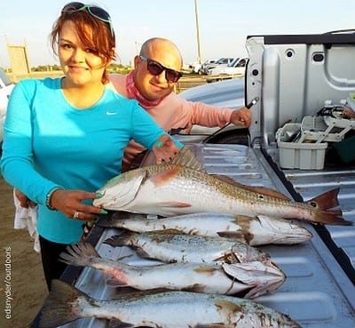 Paul and Lucia Galvan of Houston added this nice redfish Lucia caught to their catch of trout while fishing with berkely gulp