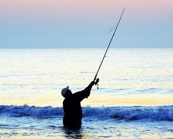 Pre-dawn surf angler's first cast of the day
