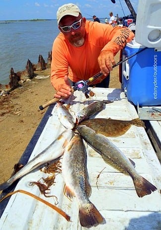 Santa Fe TX wrangler Charles O'Neal wracked up these nice trout and flounder on soft plastics