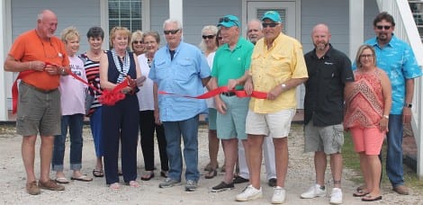 Traci Craft, joined by family and friends, and members of the Bolivar Peninsula Chamber of Commerce, cutting the ribbon for the Grand Opening of her Law Office in Crystal Beach. The office is located at 2950 Hwy 87, in the Tropical Accents Building, ground floor. 409-684-7222, tracicraft@gmail.com.