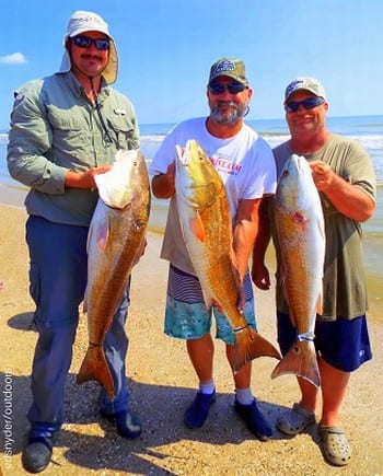 Surf anglers show their bragging rights with Jeremy Zwahr's 40incher bull red, John Ingle's 38inch bull red, and David Ingle's 33inch bull red