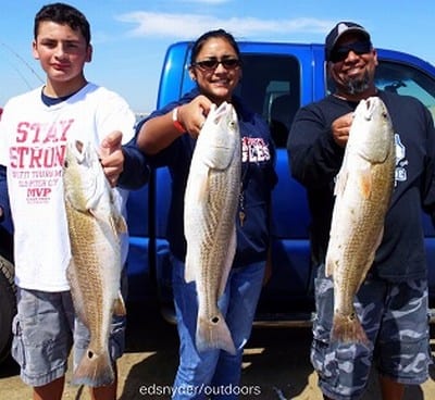 The Benavedes Familia of The Woodlands TX matched their three slot reds for home they caught on shrimp