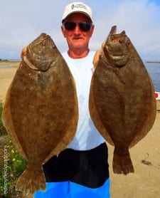 Ben Thompson of Athens TX hefts these two nice flounder caught on berkely gulp