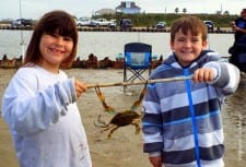 Crabbin' buds Katy Peterson of Huntsville and Dolton Howard of San Diego had fun at the pass messin' with the crabs