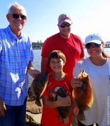 Father and son Goodsell of Dayton TX show off their flounder catching skills with LaLa and Brayden Randall