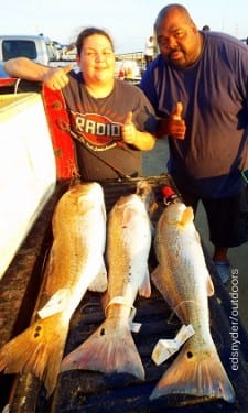 Fishin buds Vanessa Cruzan and Adrian Benson of Houston tailgated these nice 40-38-and 32inch tagger bull reds caught on crab and shrimp