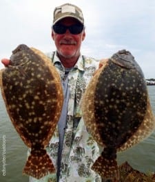 High Islander Jackie Bertolino hefts two of his 5 flounder limit he caught on berkely gulp