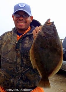 Jerraud Wood of Houston braved the north winds and monsoon rains to catch this nice flounder on shrimp