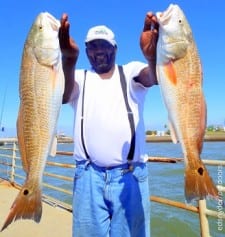 Lawrence Britton of Houston fished live shrimp for these two nice slot reds