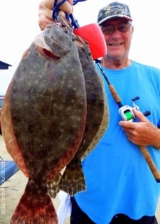 Rollover angler Chuck Meyers shows off his near limit of flounder caught on gulp