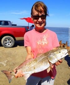 Sharon Hoyt of Montgomery TX took this nice 24inch slot red on live shrimp