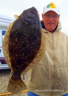 Bob Bilimek of Maud TX holding his up wife's flounder  for pictures, caught on a mud minnow