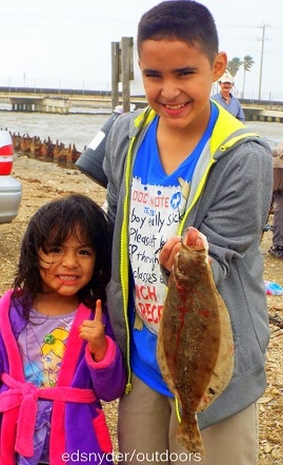 Fishin Pals Daniel Davis and Crystal Coronado of Cleveland TX teamed up to heft this nice flounder caught on a mud minnow