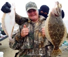 Hubby holds Dee Waldrip's nice flounder as she avoids the ICKY factor- the LaPorte TX lady fished berkely gulp
