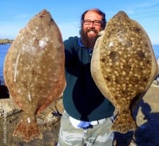 John Harris of Houston hefts his 19 and 17inch flounder he took on gulp