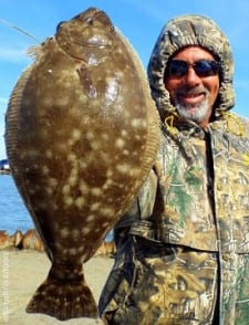 LaPorte TX angler Hefts this nice flounder caught on berkely gulp