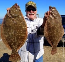 Magnolia TX angler Greg Locke shows off his 20 and 18inch flounder limit he took on gulp