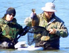 Wader Action- this wedded fishing team puts another keeper in the bag