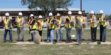 School Board members, government officials, and construction representatives participated in the groundbreaking ceremony