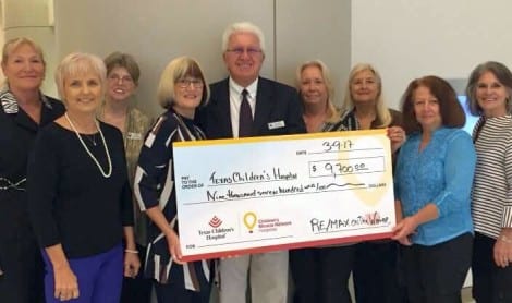 RE/MAX On The Water presented check to CMN-Texas Children's Hospital which was proceeds from Golf Tournament. Thank you to all the players and sponsors who made this possible.
